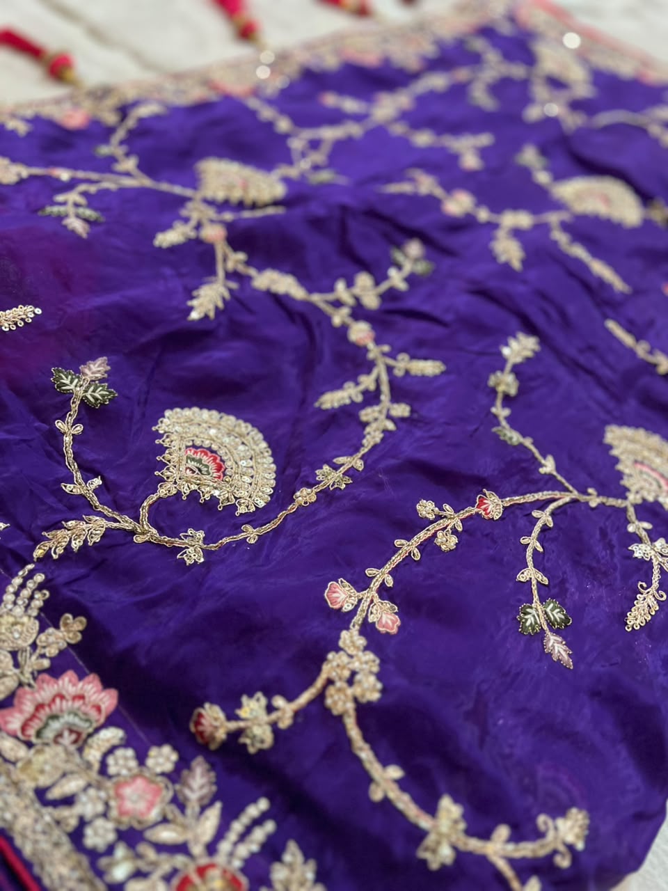 Heavy work Purple Silk Saree with Beautiful Tussles at the Pallu and Heavy Pink Contrast Blouse. You can call it Madhuri Dixit inspired “Hum Aapke hain Koun Saree “