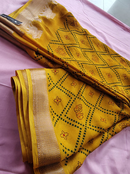 Beautiful Yellow Color Bandhini Mosmelo Saree with Designer Border