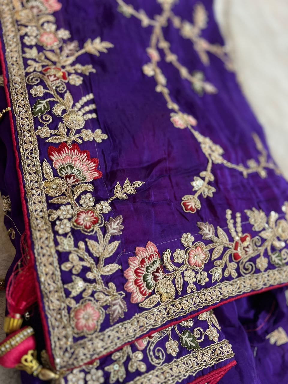 Heavy work Purple Silk Saree with Beautiful Tussles at the Pallu and Heavy Pink Contrast Blouse. You can call it Madhuri Dixit inspired “Hum Aapke hain Koun Saree “