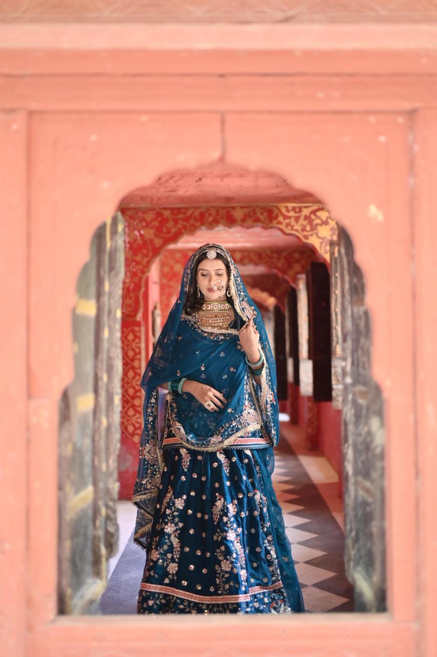 A masterpiece of grace — a peacock-inspired Royal Blue Poshak with a Royal Full Ghera and Pure, Luxurious Fabric. Timeless, Traditional, and Truly Breathtaking. (Stitched)
