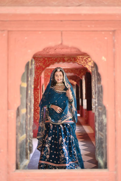 A masterpiece of grace — a peacock-inspired Royal Blue Poshak with a Royal Full Ghera and Pure, Luxurious Fabric. Timeless, Traditional, and Truly Breathtaking. (Stitched)