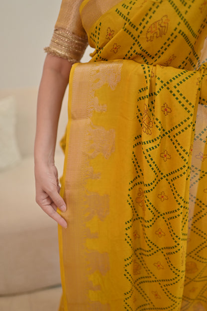 Beautiful Yellow Color Bandhini Mosmelo Saree with Designer Border