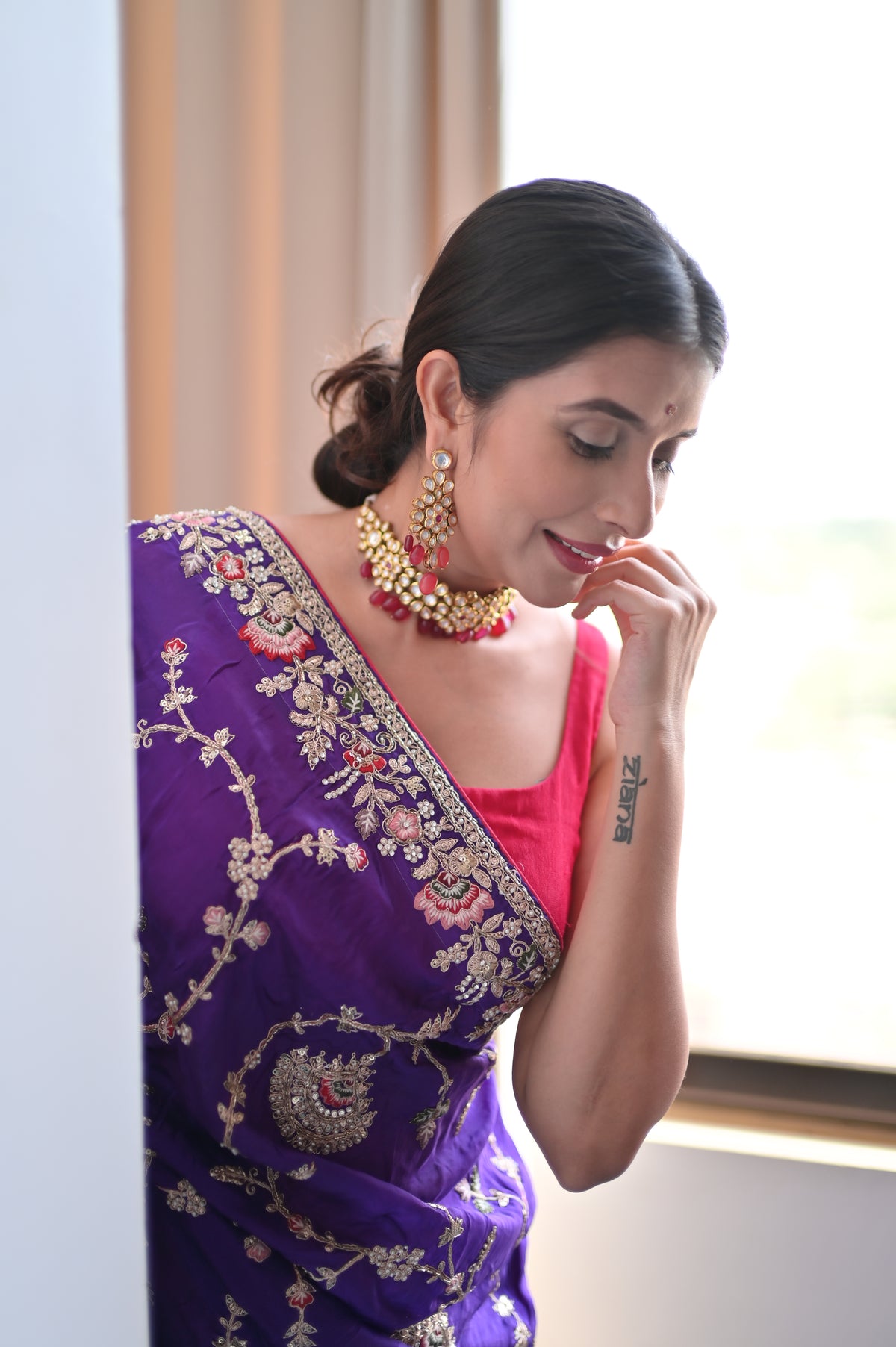 Heavy work Purple Silk Saree with Beautiful Tussles at the Pallu and Heavy Pink Contrast Blouse. You can call it Madhuri Dixit inspired “Hum Aapke hain Koun Saree “