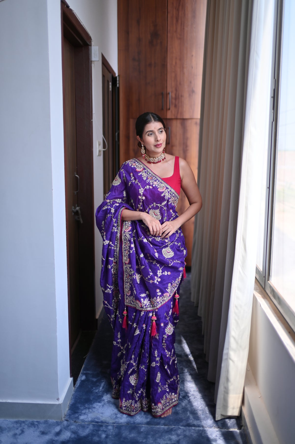 Heavy work Purple Silk Saree with Beautiful Tussles at the Pallu and Heavy Pink Contrast Blouse. You can call it Madhuri Dixit inspired “Hum Aapke hain Koun Saree “