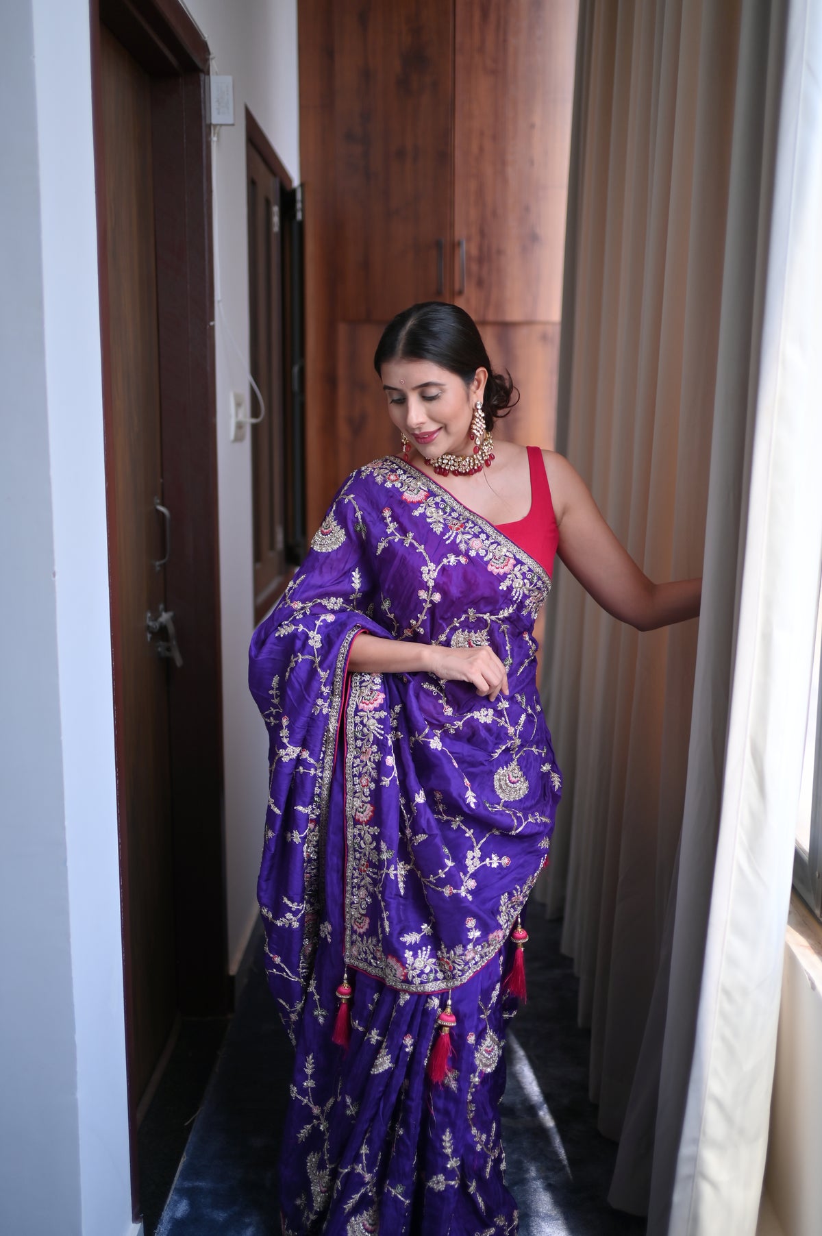 Heavy work Purple Silk Saree with Beautiful Tussles at the Pallu and Heavy Pink Contrast Blouse. You can call it Madhuri Dixit inspired “Hum Aapke hain Koun Saree “