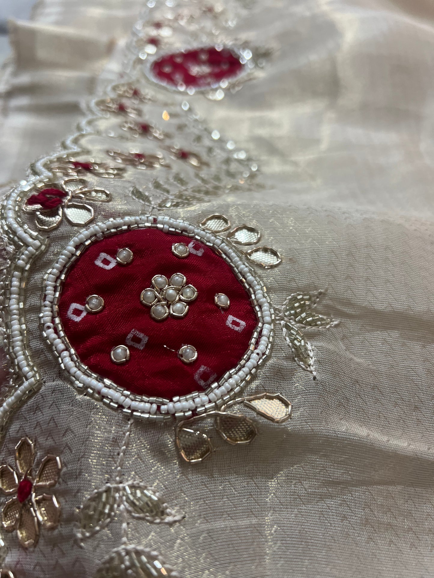 Beautiful Ceam Tissue Saree with Bandini and Gota Touch Zardozi Work and Red Colour Blouse with Gota and Zardozi work on Sleeves and Back