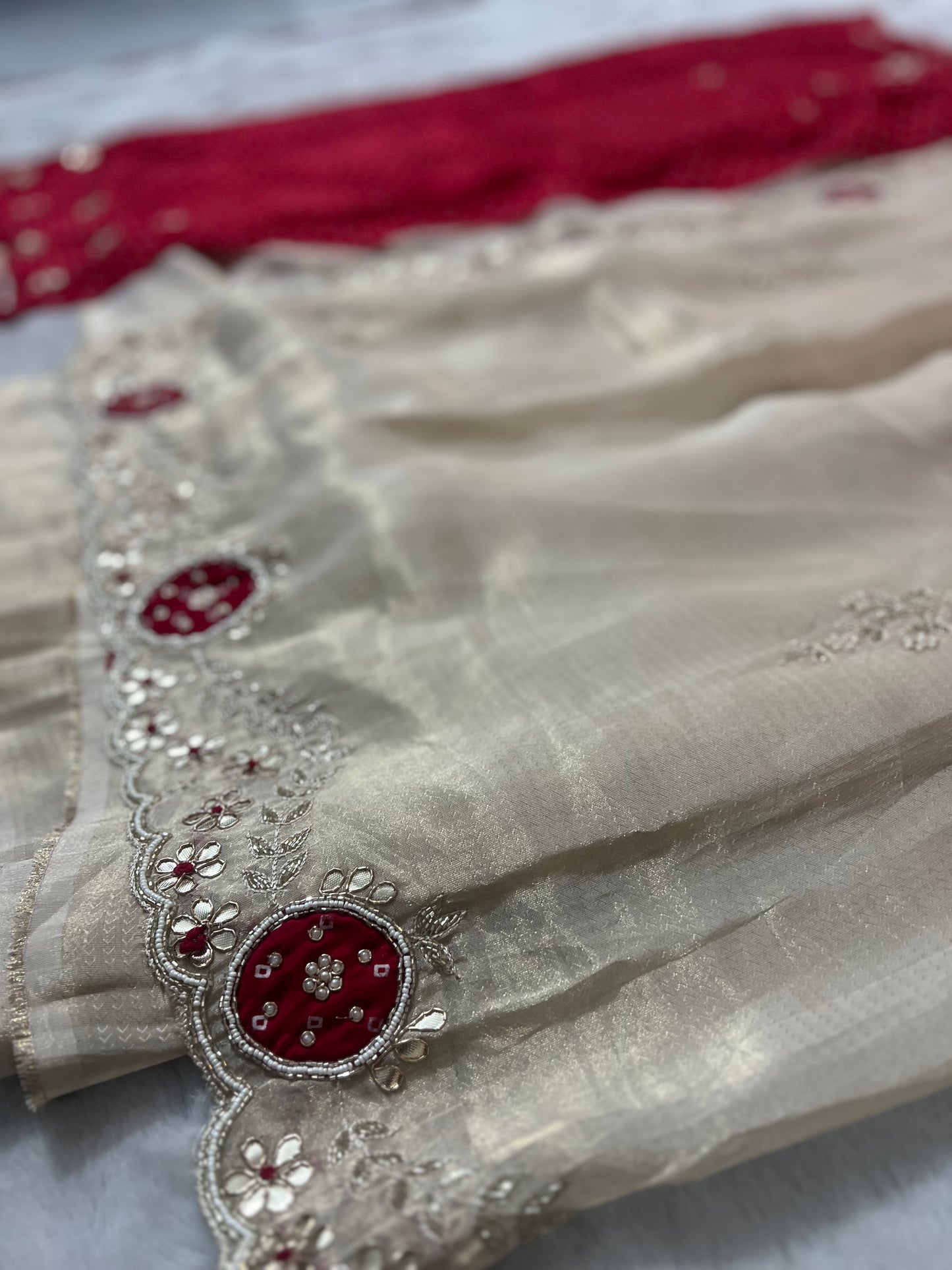 Beautiful Ceam Tissue Saree with Bandini and Gota Touch Zardozi Work and Red Colour Blouse with Gota and Zardozi work on Sleeves and Back