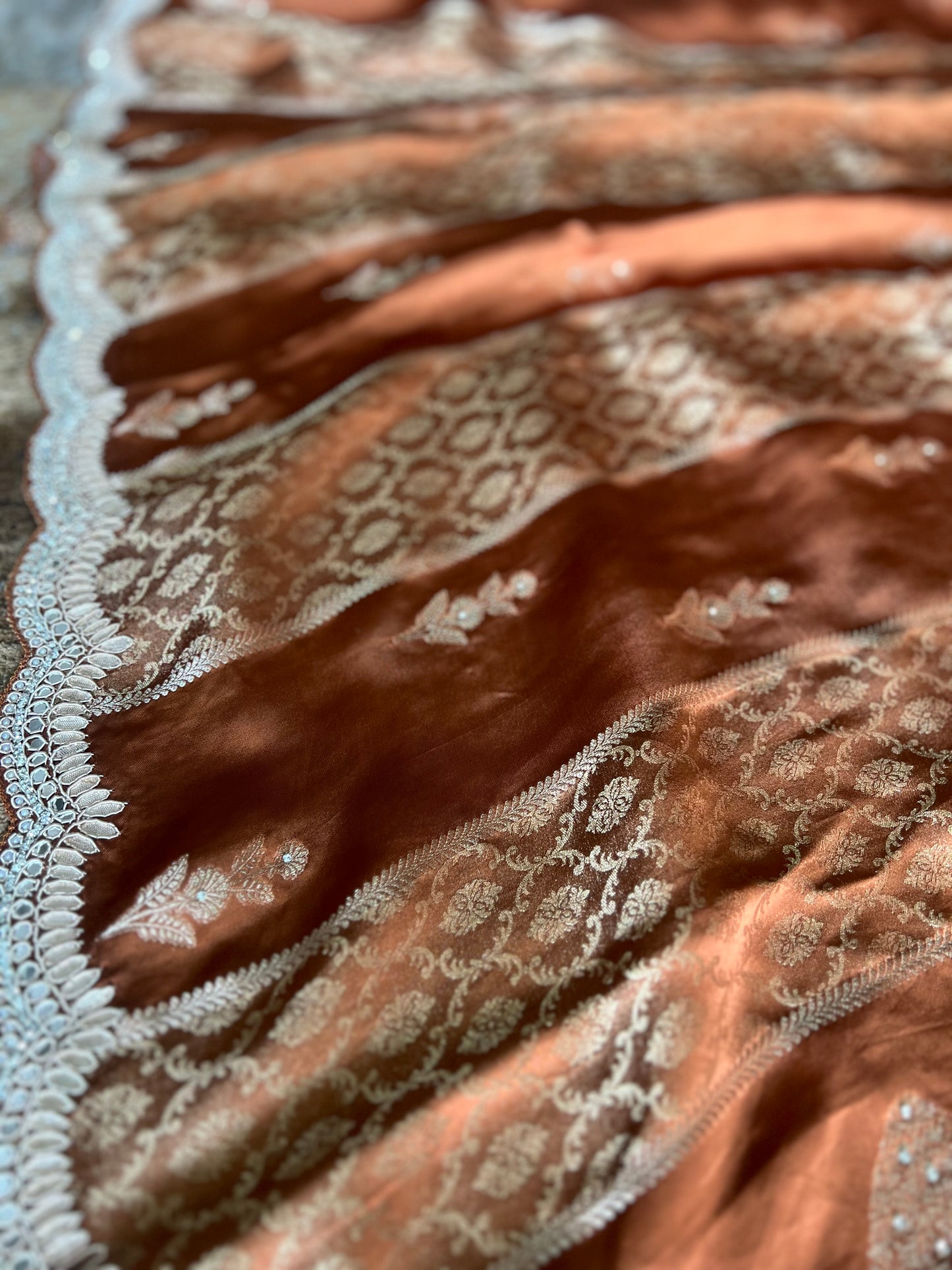 Beautiful Coffee colour Modal Silk Saree with lovely designer zari work on the border and the booties are made up of mirror, Gota and little bit of Zardozi touch.  And the blouse piece makes it look even more beautiful.