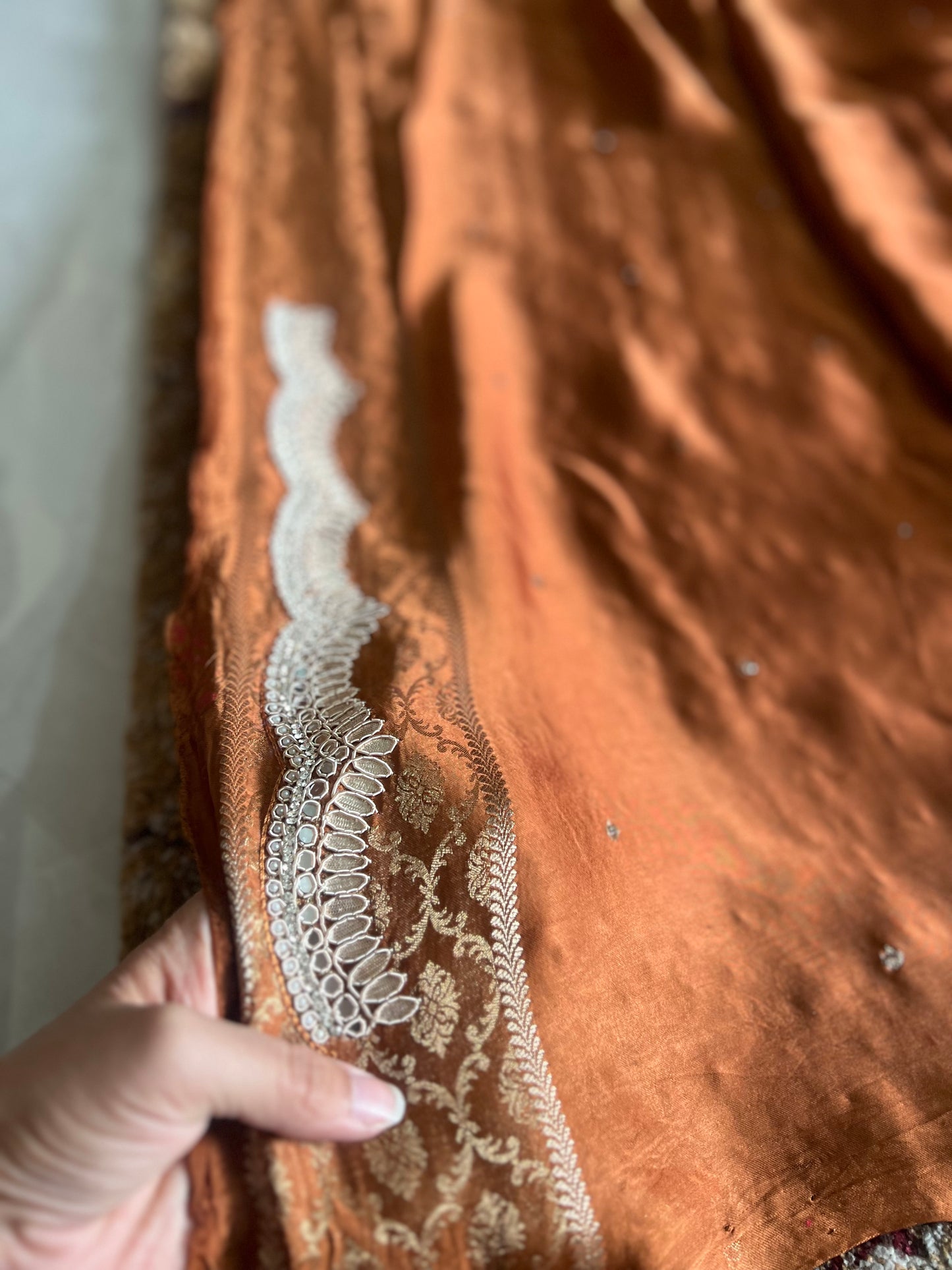 Beautiful Coffee colour Modal Silk Saree with lovely designer zari work on the border and the booties are made up of mirror, Gota and little bit of Zardozi touch.  And the blouse piece makes it look even more beautiful.