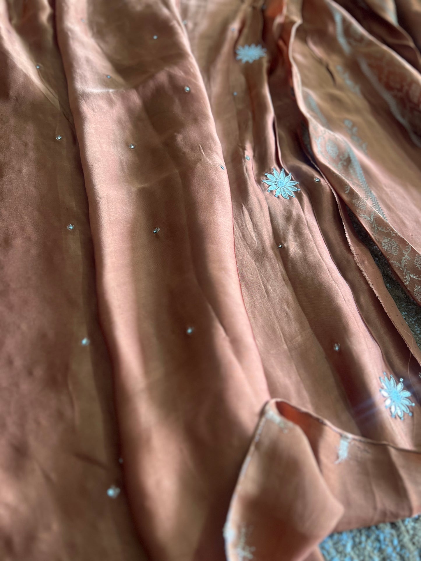 Beautiful Coffee colour Modal Silk Saree with lovely designer zari work on the border and the booties are made up of mirror, Gota and little bit of Zardozi touch.  And the blouse piece makes it look even more beautiful.