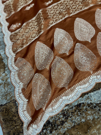 Beautiful Coffee colour Modal Silk Saree with lovely designer zari work on the border and the booties are made up of mirror, Gota and little bit of Zardozi touch.  And the blouse piece makes it look even more beautiful.