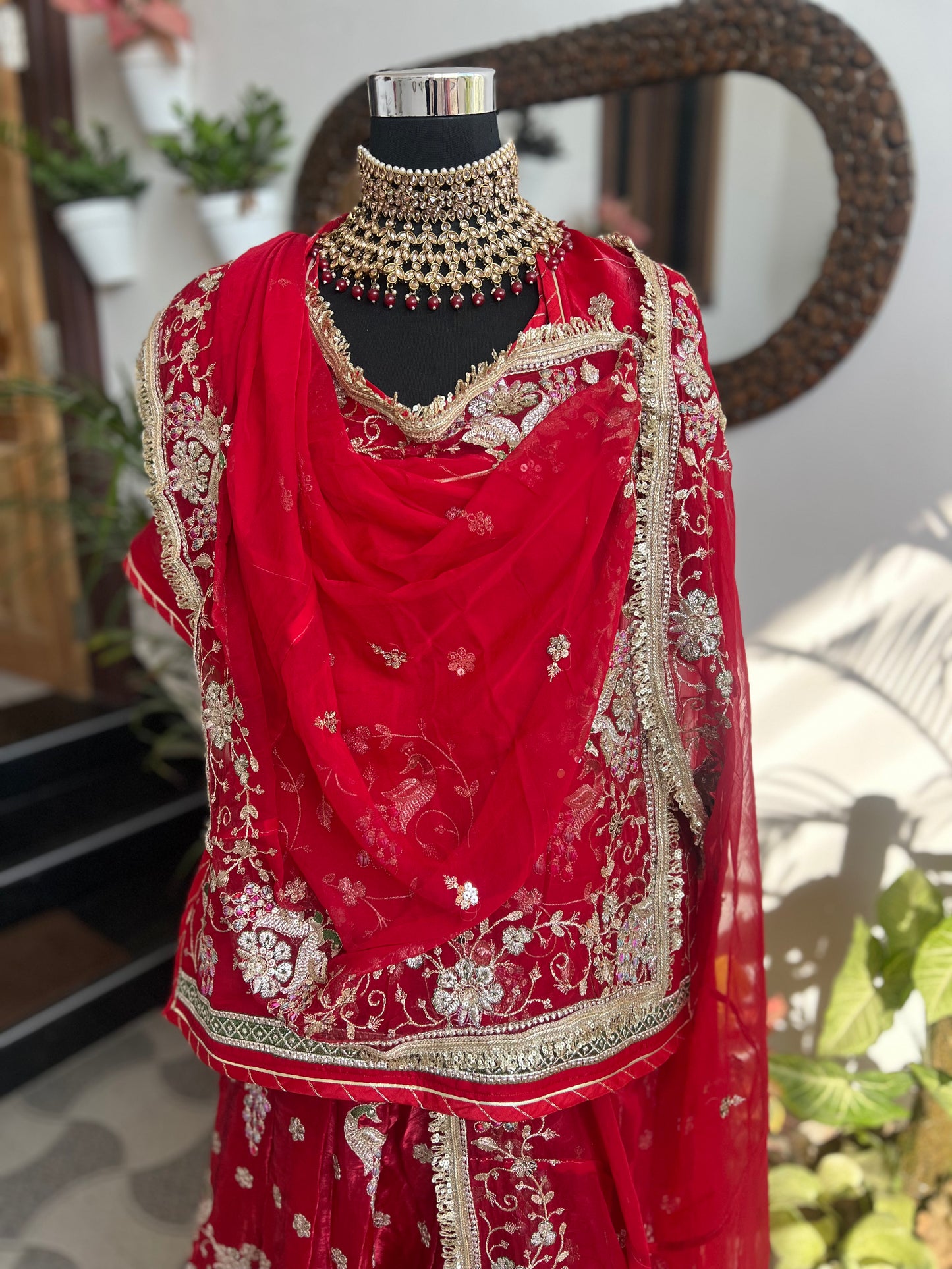 Royalty in every swirl — peacock motifs, full ghera, and the richness of pure fabric. A poshak that tells its own story. (Stitched).