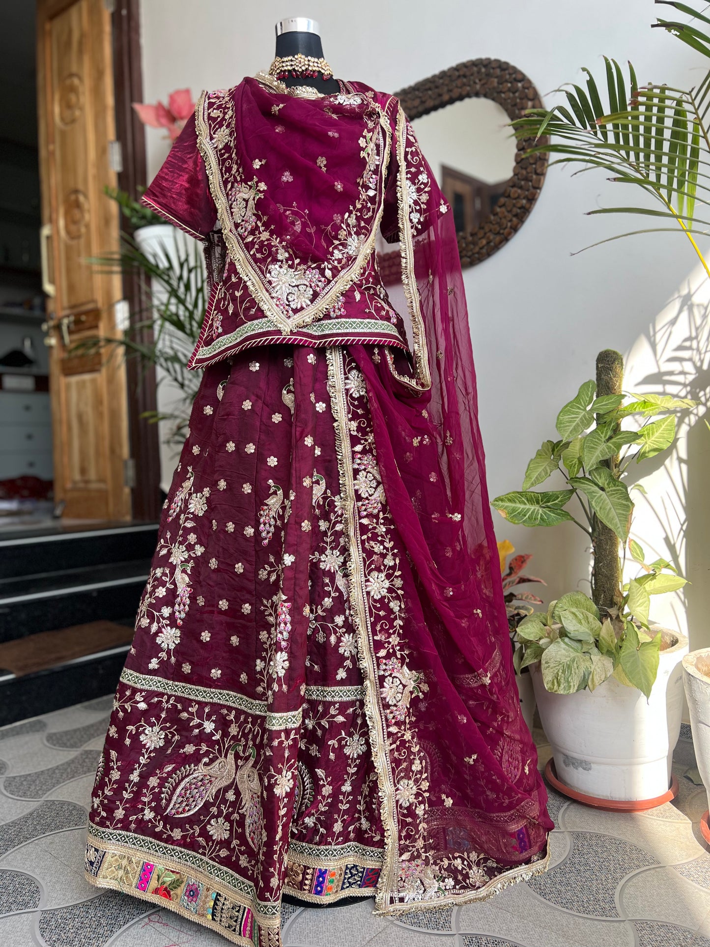 A masterpiece of grace — a peacock-inspired poshak with a royal full ghera and pure, luxurious fabric. Timeless, traditional, and truly breathtaking. (Stitched)