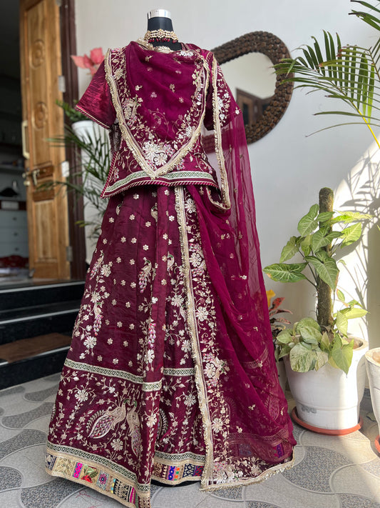 A masterpiece of grace — a peacock-inspired poshak with a royal full ghera and pure, luxurious fabric. Timeless, traditional, and truly breathtaking. (Stitched)