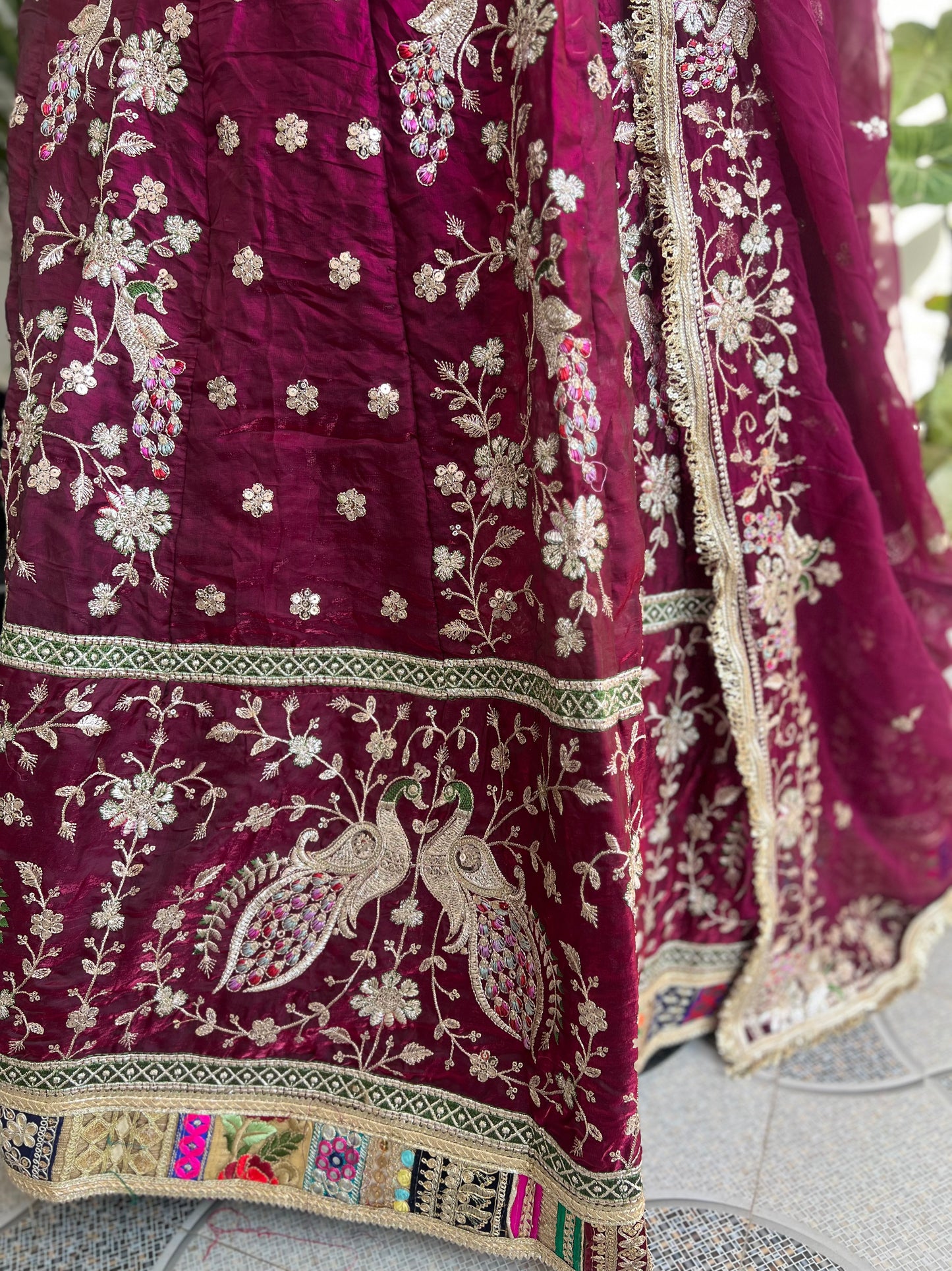 A masterpiece of grace — a peacock-inspired poshak with a royal full ghera and pure, luxurious fabric. Timeless, traditional, and truly breathtaking. (Stitched)