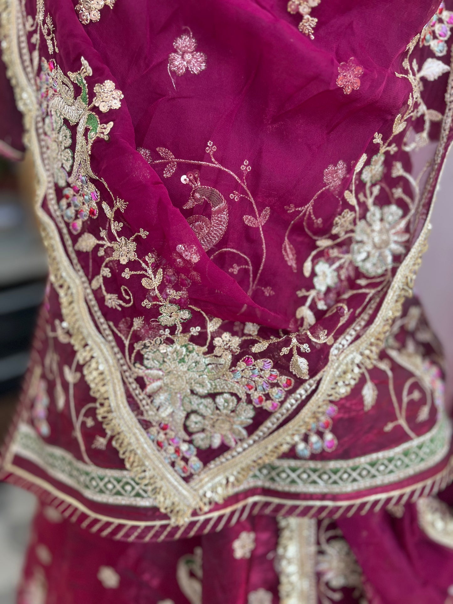 A masterpiece of grace — a peacock-inspired poshak with a royal full ghera and pure, luxurious fabric. Timeless, traditional, and truly breathtaking. (Stitched)