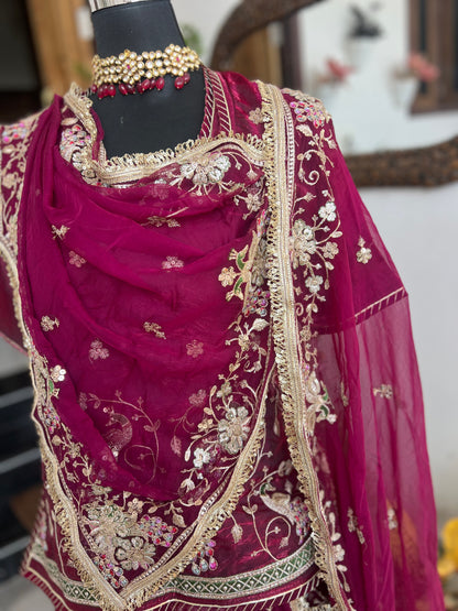 A masterpiece of grace — a peacock-inspired poshak with a royal full ghera and pure, luxurious fabric. Timeless, traditional, and truly breathtaking. (Stitched)