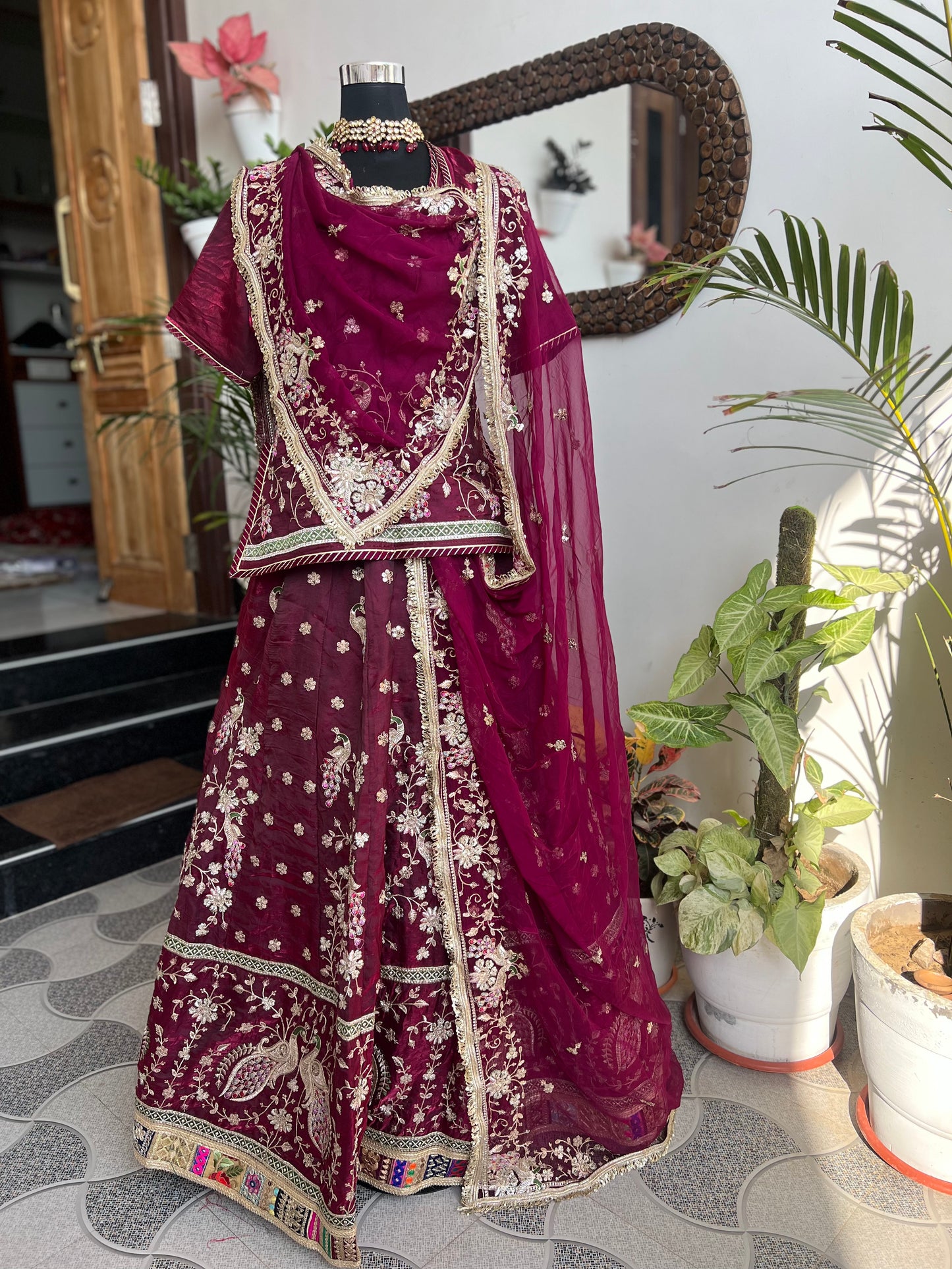 A masterpiece of grace — a peacock-inspired poshak with a royal full ghera and pure, luxurious fabric. Timeless, traditional, and truly breathtaking. (Stitched)