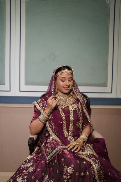 A masterpiece of grace — a peacock-inspired poshak with a royal full ghera and pure, luxurious fabric. Timeless, traditional, and truly breathtaking. (Stitched)