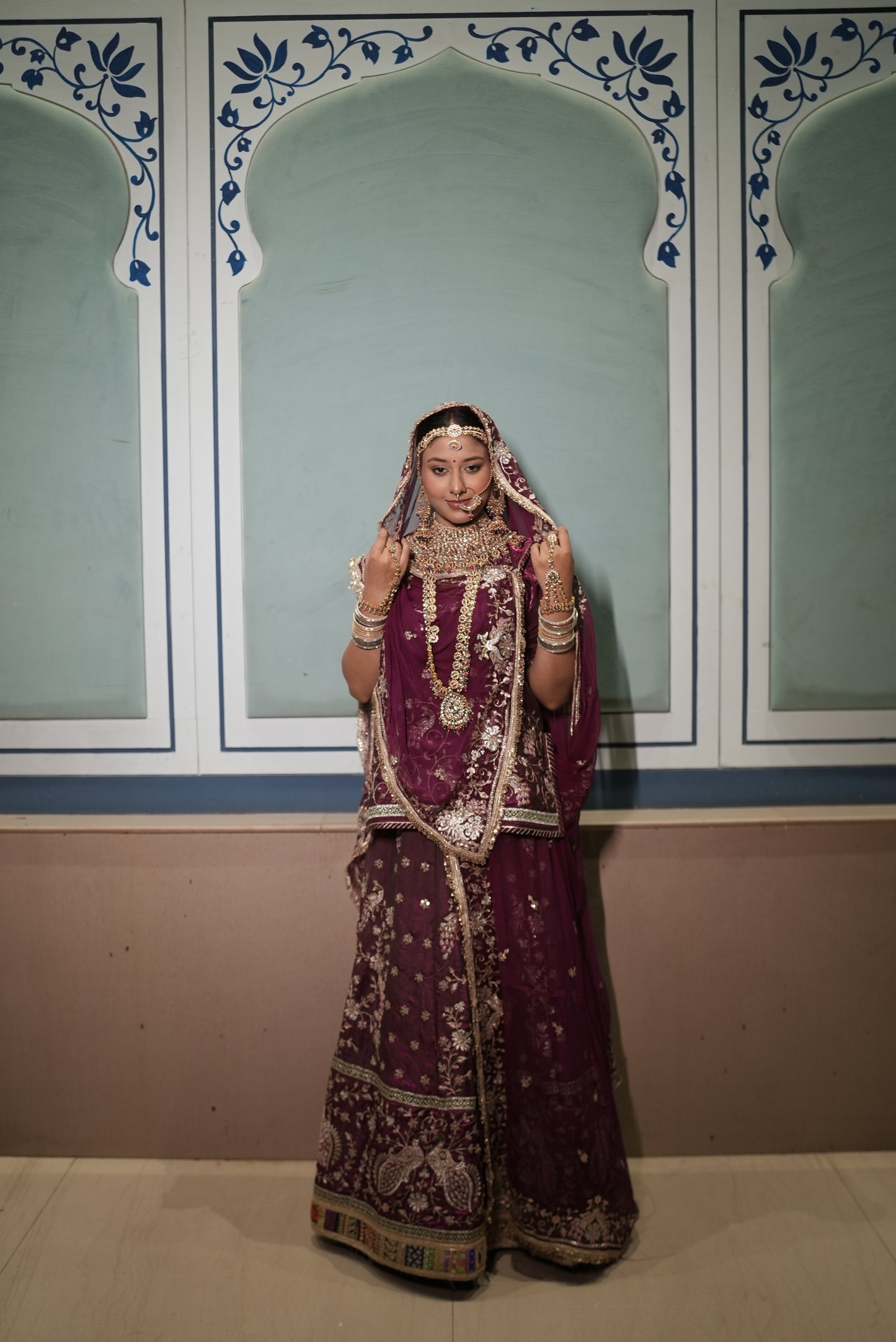A masterpiece of grace — a peacock-inspired poshak with a royal full ghera and pure, luxurious fabric. Timeless, traditional, and truly breathtaking. (Stitched)