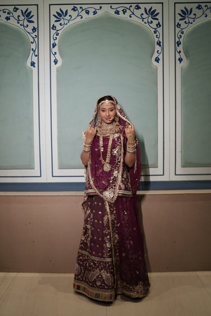 A masterpiece of grace — a peacock-inspired poshak with a royal full ghera and pure, luxurious fabric. Timeless, traditional, and truly breathtaking. (Stitched)