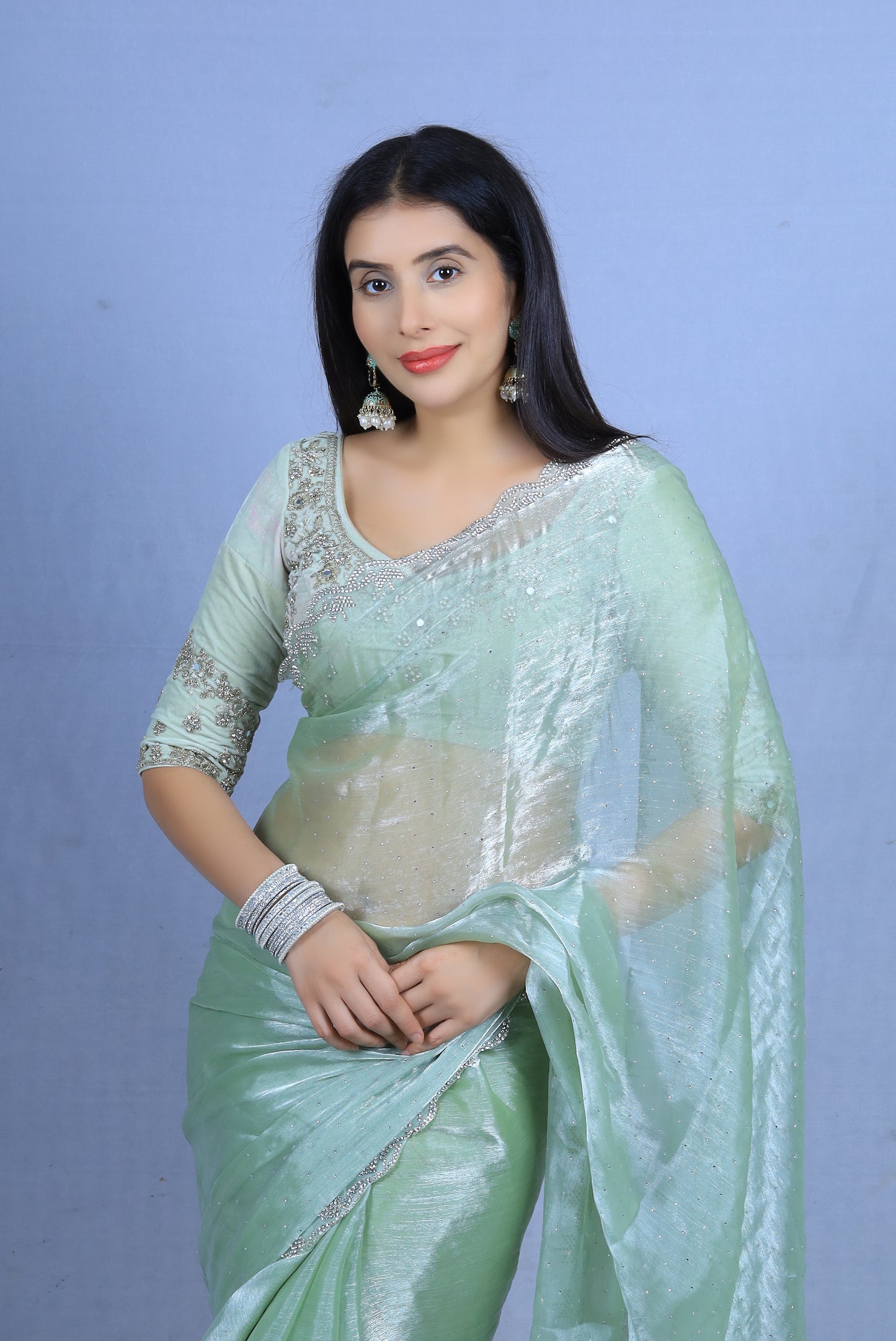 Sea green organza silk saree with diamond work and same fabric blouse