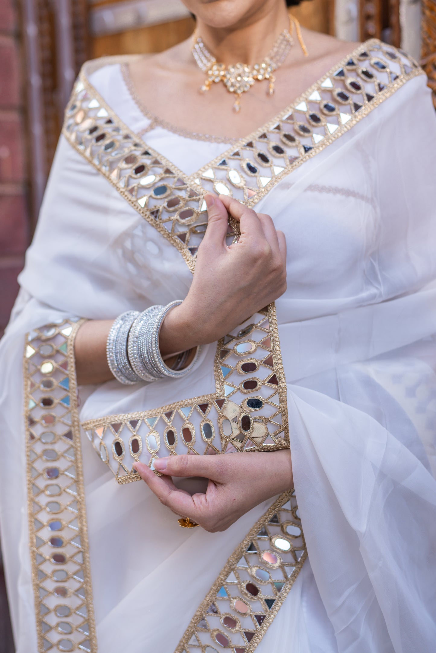 White organza mirror work saree with same stitched blouse