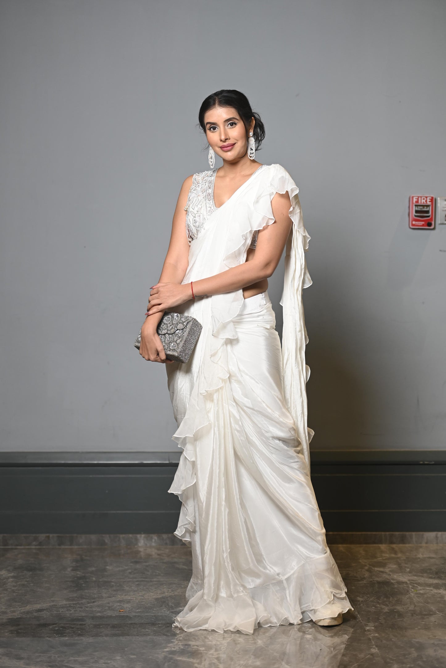 White frill, stitched sari with pearl blouse